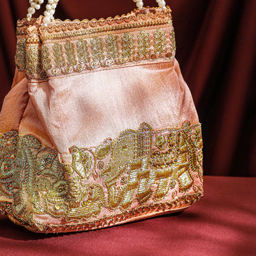 Rubans Handcrafted Peach Pink Silk Potli Bag with Pearl Handle & Gold Embroidered Elephant Motif Bags