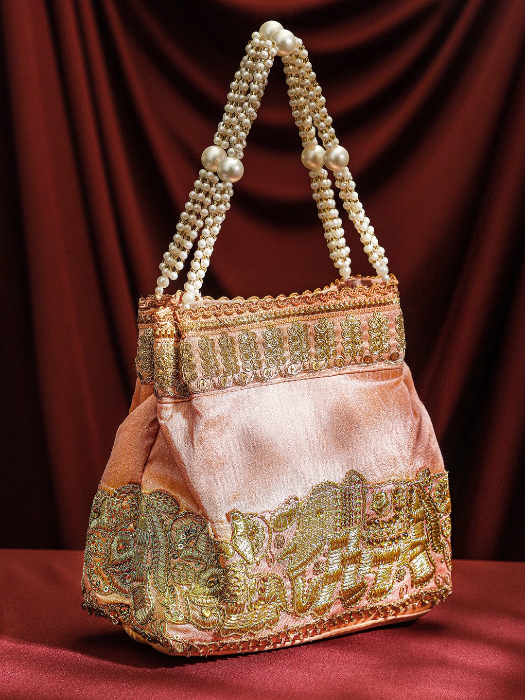 Rubans Handcrafted Peach Pink Silk Potli Bag with Pearl Handle & Gold Embroidered Elephant Motif Bags