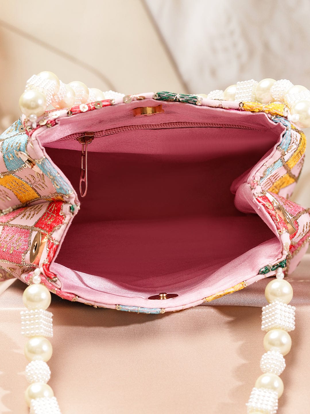 Rubans Multicolour Embroidered Potli Bag with Pearl Beaded Handle on Light Pink Base Bags