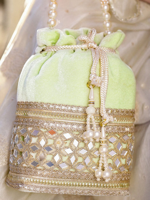 Rubans Pastel Mint Green Velvet Potli Bag with Pearl Handle, Mirror Embroidery & Tassel Detailing Bags
