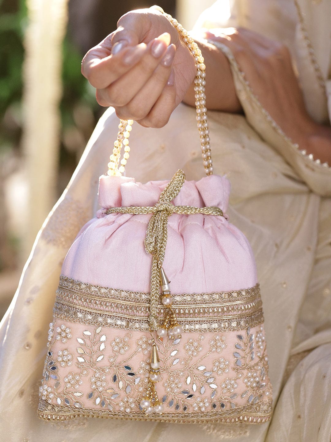 Rubans Pastel Pink Potli Bag with Golden Zari, Mirror & Floral Embroidery & Beaded Handle Bags