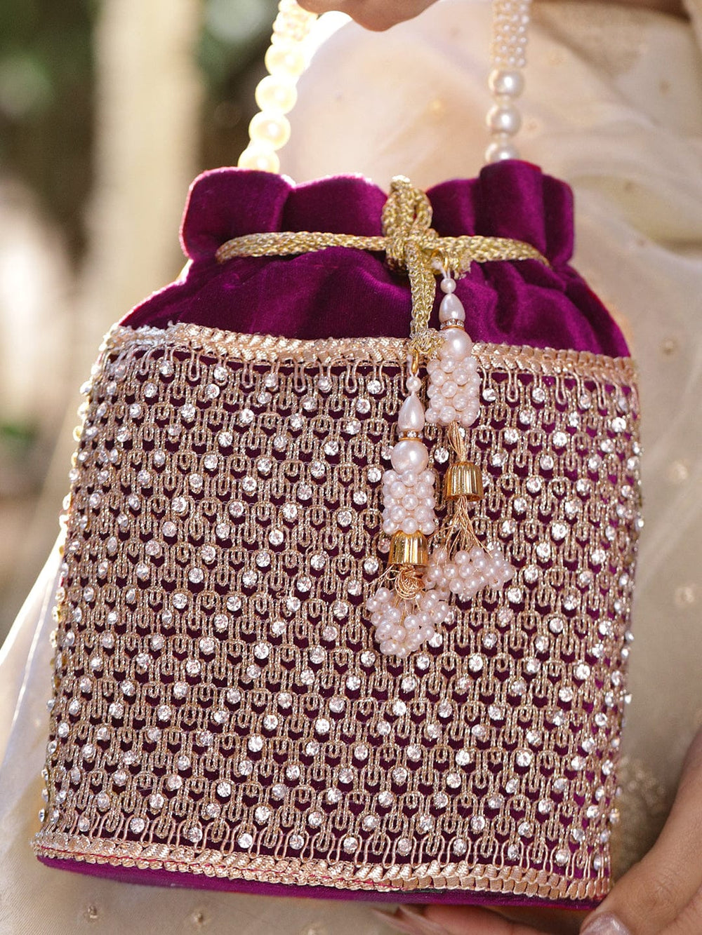 Rubans Purple Velvet Potli Bag with Pearl Handle, Golden Embroidery & Stone Detailing Bags
