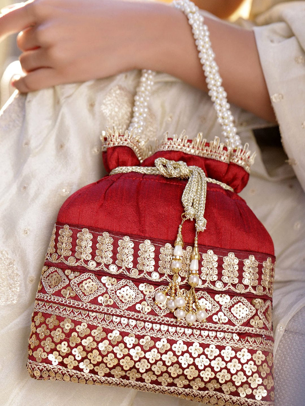 Rubans Red & Gold Embroidered Potli Bag with Pearl Handle & Beaded Tassel Detailing Bags
