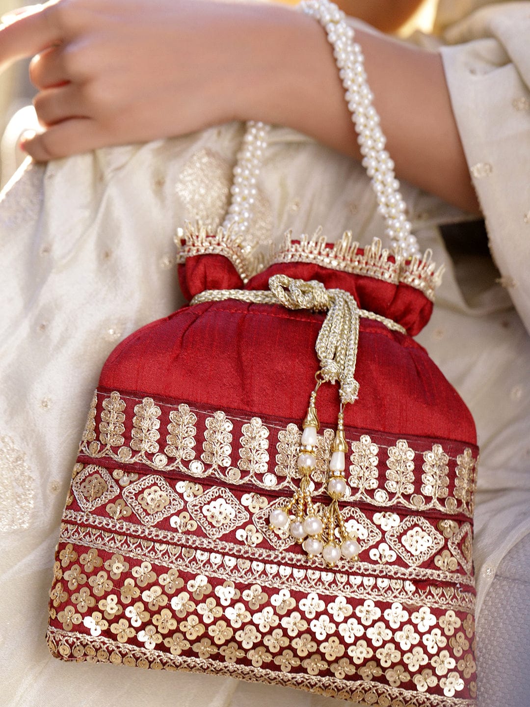 Rubans Red & Gold Embroidered Potli Bag with Pearl Handle & Beaded Tassel Detailing Bags