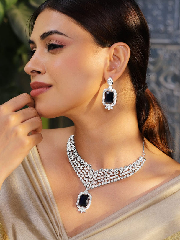 Rubans Rhodium-Plated Blue Sapphire & White Cubic Zirconia Studded Luxe V-Shaped Statement Necklace Set Jewellery Set