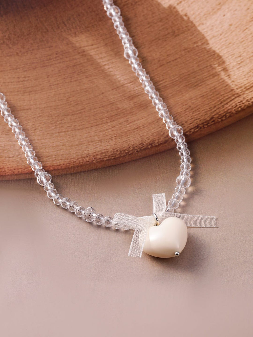 Rubans Rhodium Plated Crystal Beaded Necklace with Heart Pendant and Bow Detailing Necklace & Chains