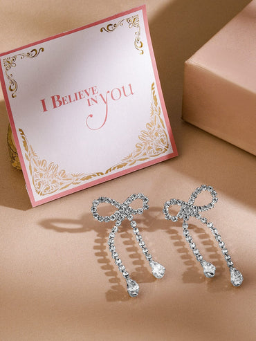 Rubans Rhodium Plated Cubic Zirconia Bow Drop Earrings Earrings