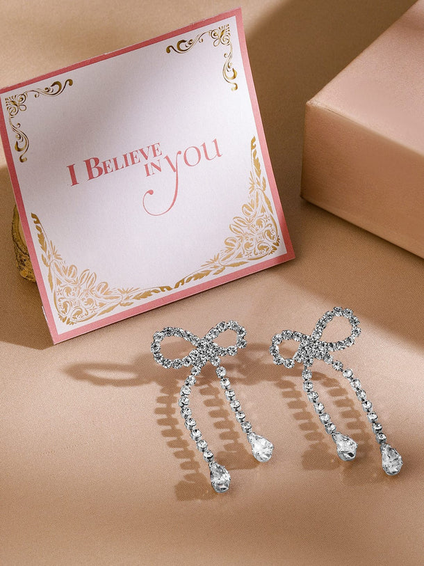 Rubans Rhodium Plated Cubic Zirconia Bow Drop Earrings Earrings