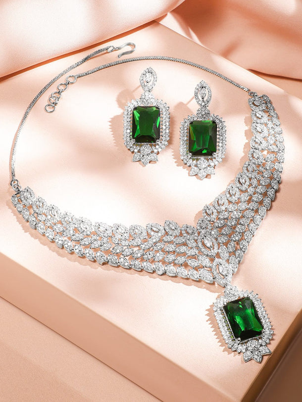 Rubans Rhodium-Plated Emerald Green & White Cubic Zirconia Studded Luxe V-Shaped Statement Necklace Set Jewellery Set