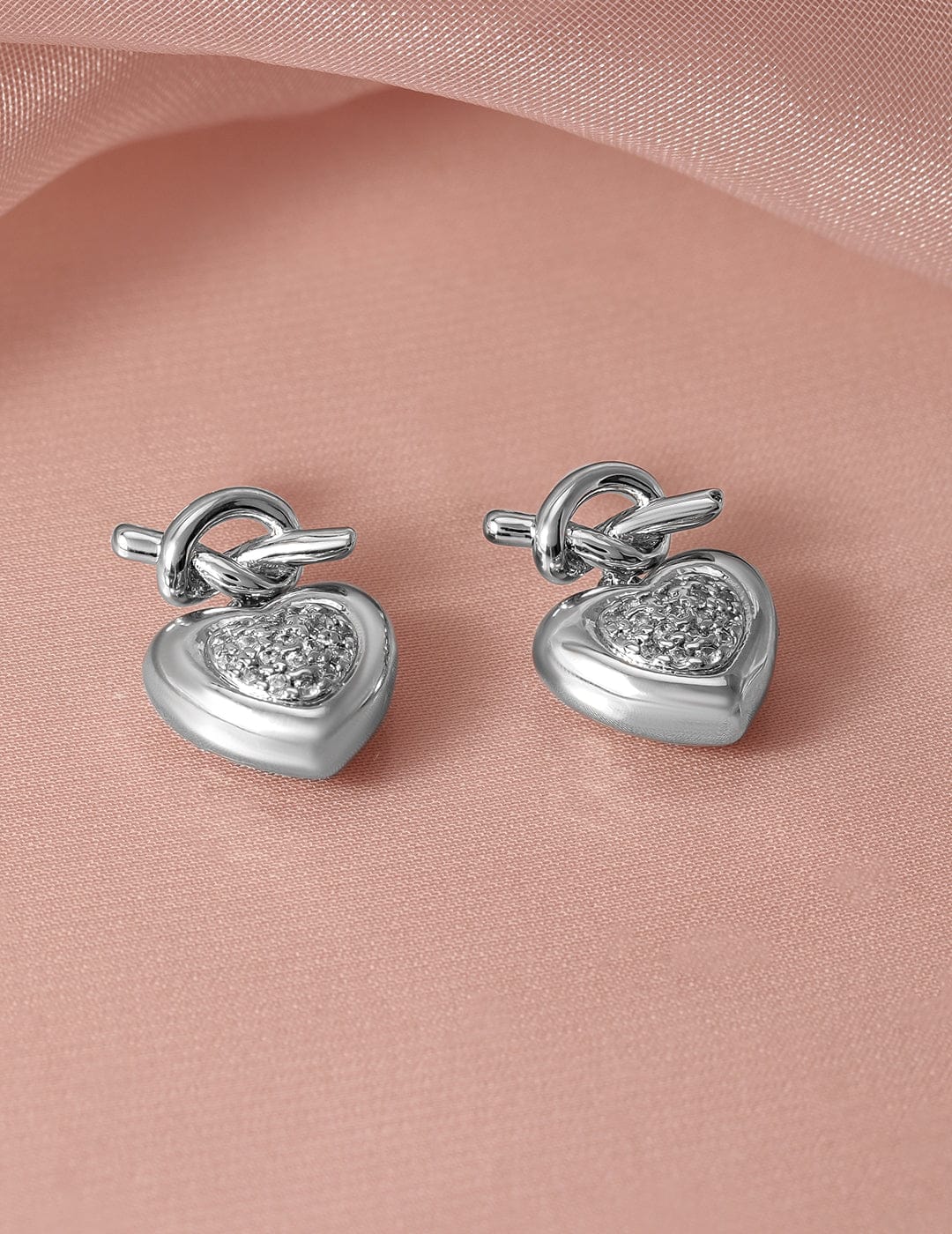 Rubans Rhodium Plated Heart Knot Design Cubic Zirconia Studded Drop Earrings Earrings