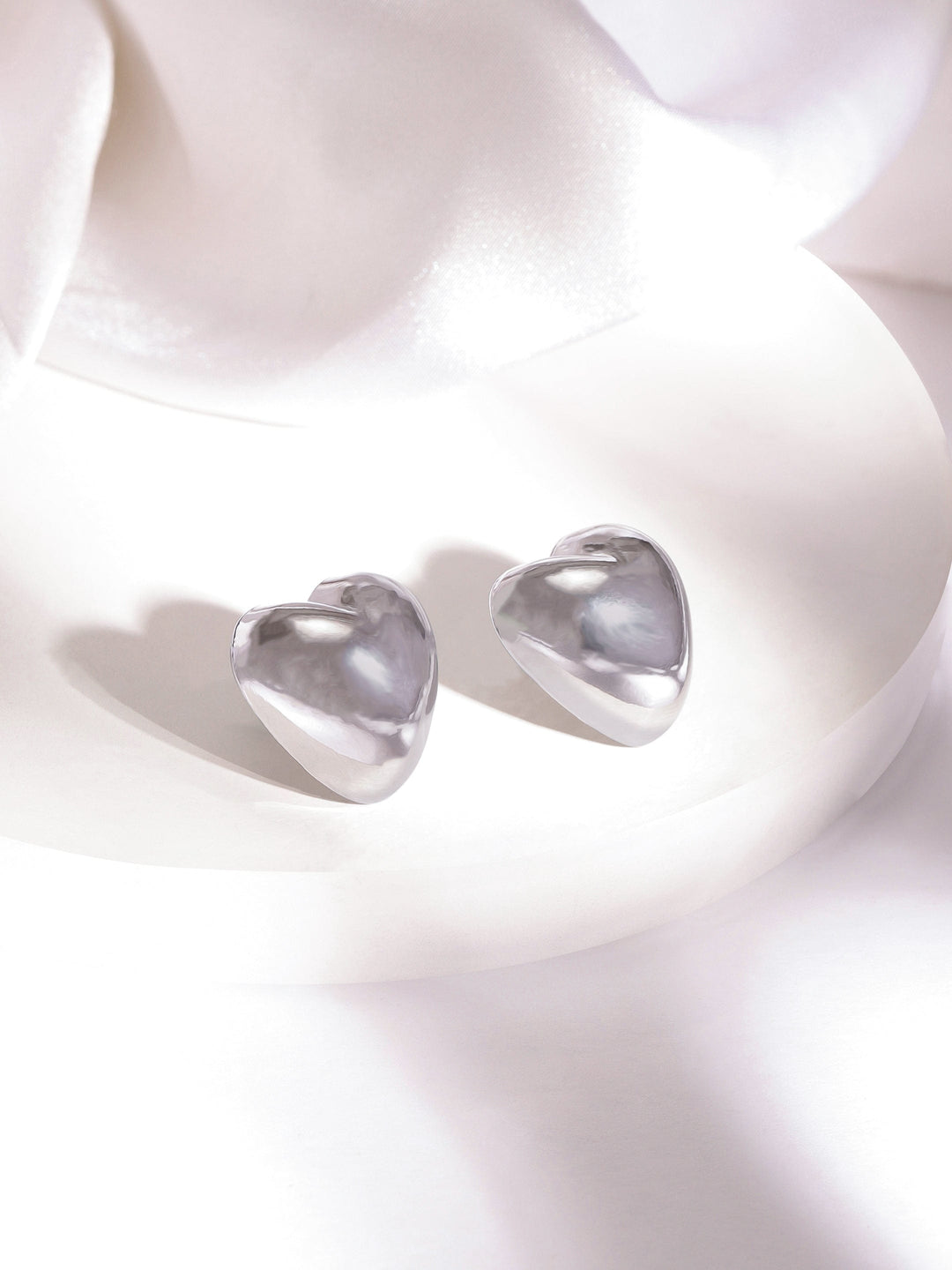 Rubans Rhodium Plated Heart Shaped Stud Earrings with Sleek Silver Tone Finish Stud Earrings