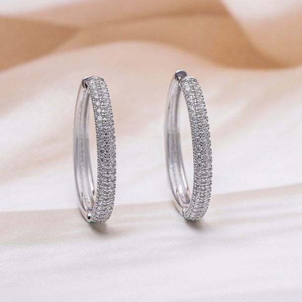 Rubans Rhodium Plated Sparkling Cubic Zirconia Studded Hoop Earrings Earrings