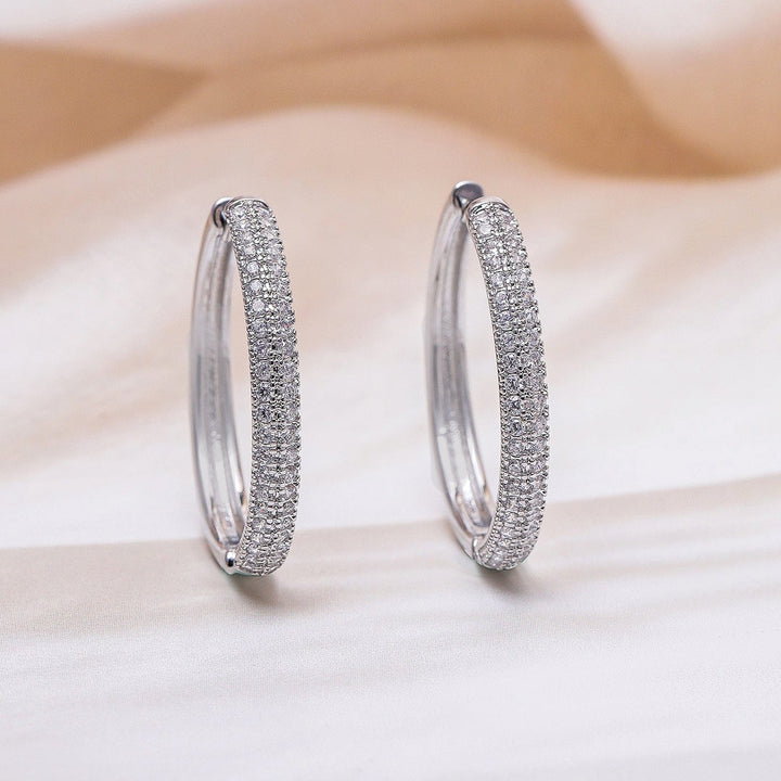 Rubans Rhodium Plated Sparkling Cubic Zirconia Studded Hoop Earrings Earrings