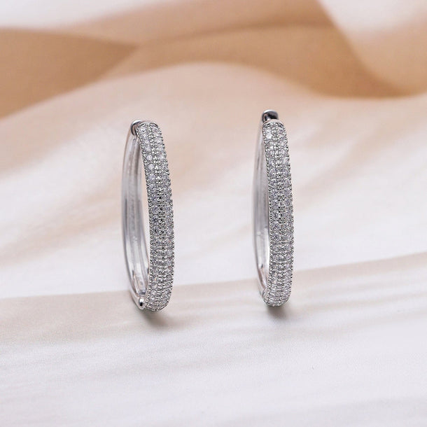 Rubans Rhodium Plated Sparkling Cubic Zirconia Studded Hoop Earrings Earrings