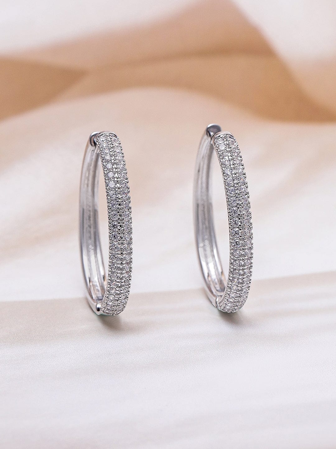 Rubans Rhodium Plated Sparkling Cubic Zirconia Studded Hoop Earrings Earrings