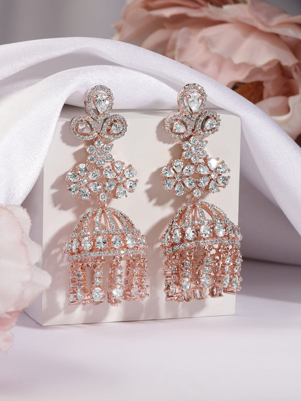 Rubans rose gold plated jhumka earrings with studded american stones. Earrings