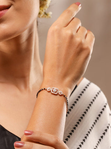 Rubans Rose Gold-Plated White Cubic Zirconia Studded Floral Mangalsutra Bracelet with Black Beads for Women Bangles & Bracelet