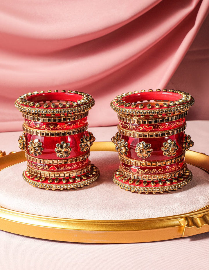 Rubans Set of 18 Gold-Plated Bridal Chura Bangles with Floral Motifs and Red Detailing Bangles