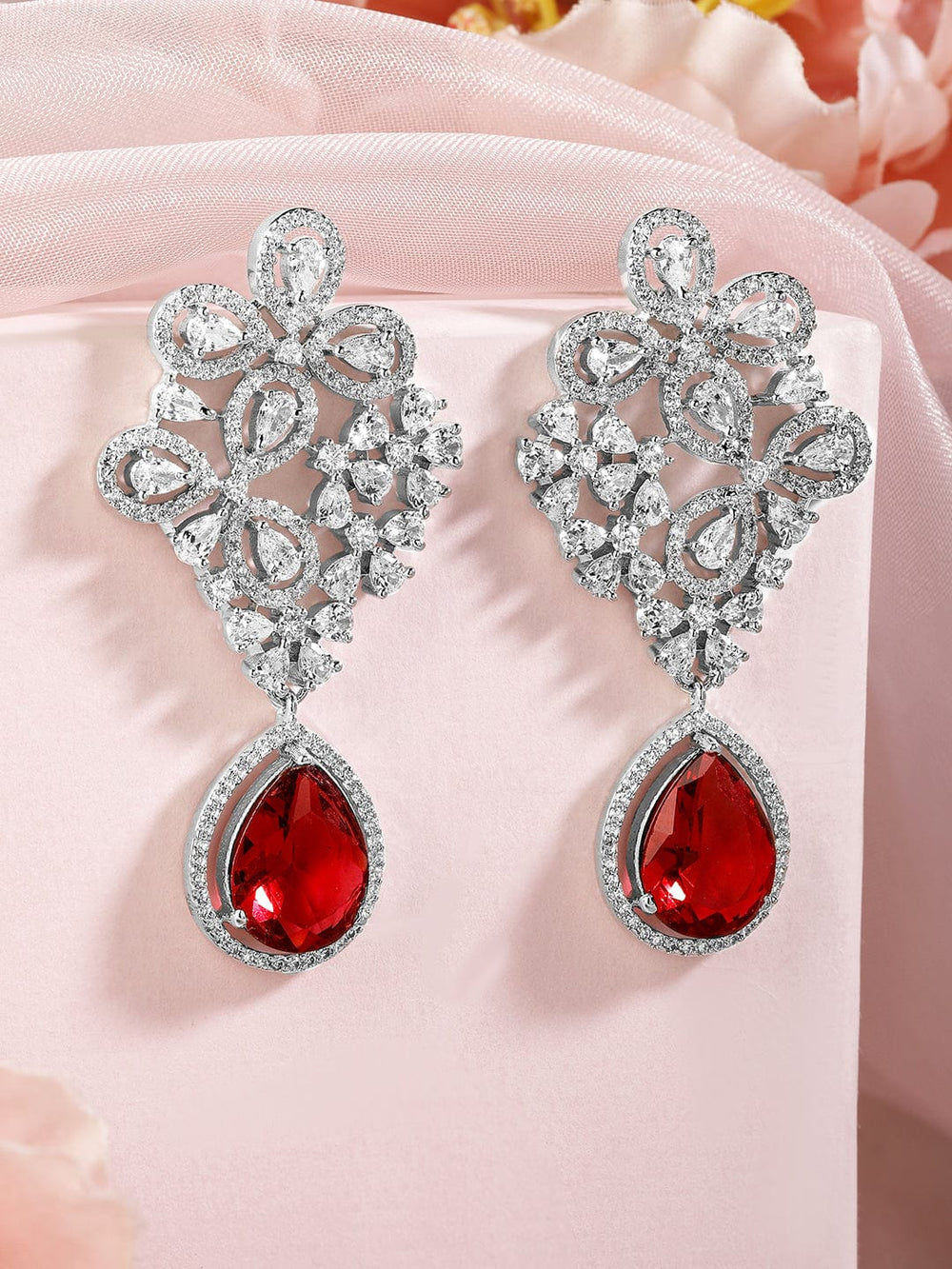 Rubans silver plated earrings with studded american diamonds and red stones. Earrings