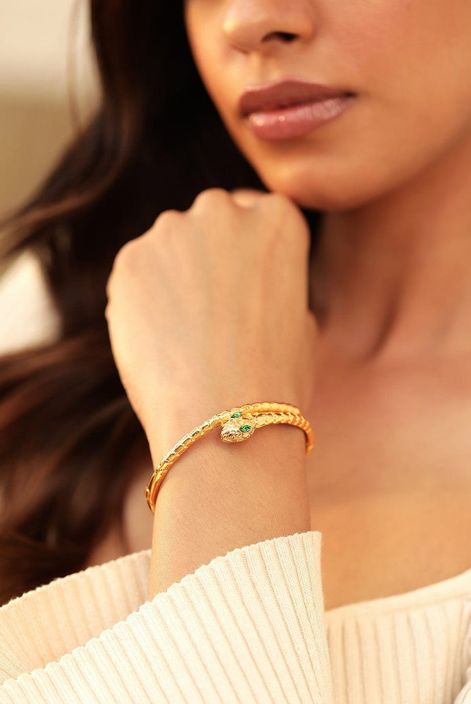 YELLOW GOLD BANGLE BRACELET WITH BAGUETTE EMERALDS AND DIAMONDS, .78 C -  Howard's Jewelry Center