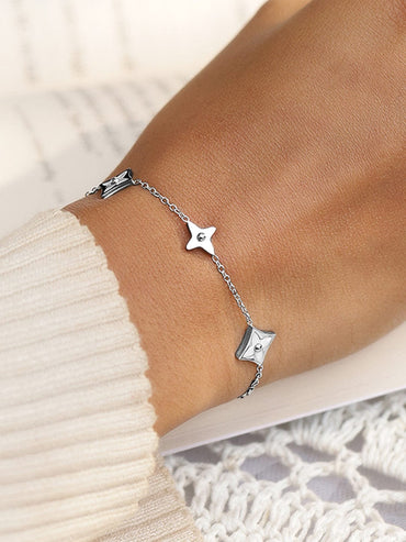 Rubans Voguish Rhodium Plated StainlessSteel TarnishFree Waterproof Floral Charm Bracelet Wristwear