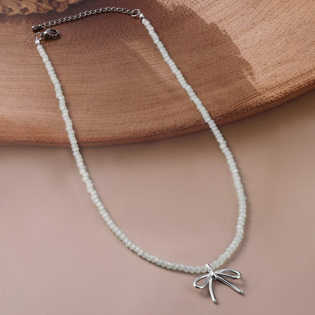 Silver Bow Pendant with White Bead Necklace Necklace