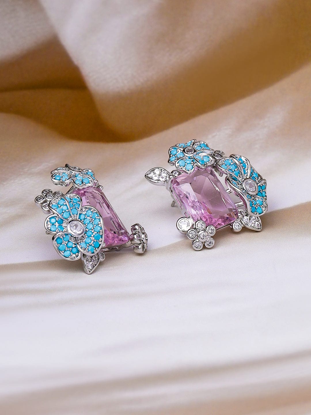 Voguish Rhodium Plated Blue Stone & Crystal Light Pink Zirconia Studded Floral Stud Earrings Stud Earrings