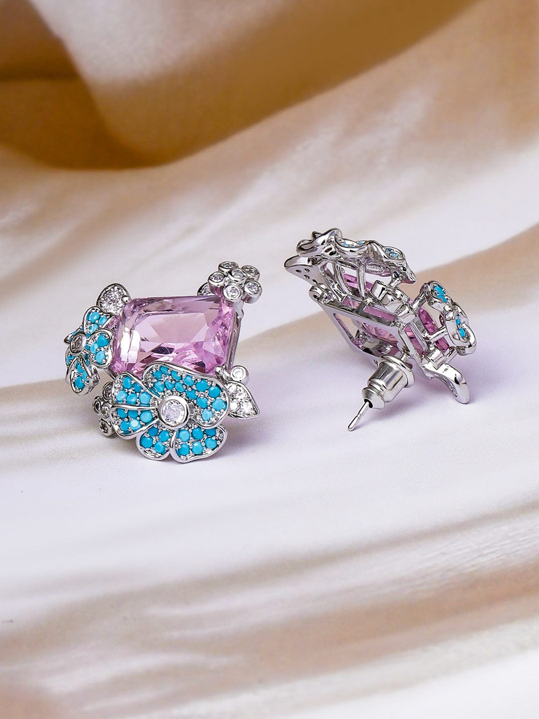 Voguish Rhodium Plated Blue Stone & Crystal Light Pink Zirconia Studded Floral Stud Earrings Stud Earrings