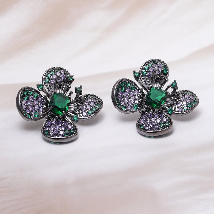 Voguish Rhodium-Plated Emerald & Lavender AD & Cubic Zirconia Studded Black-Tone Floral Stud Earrings Stud