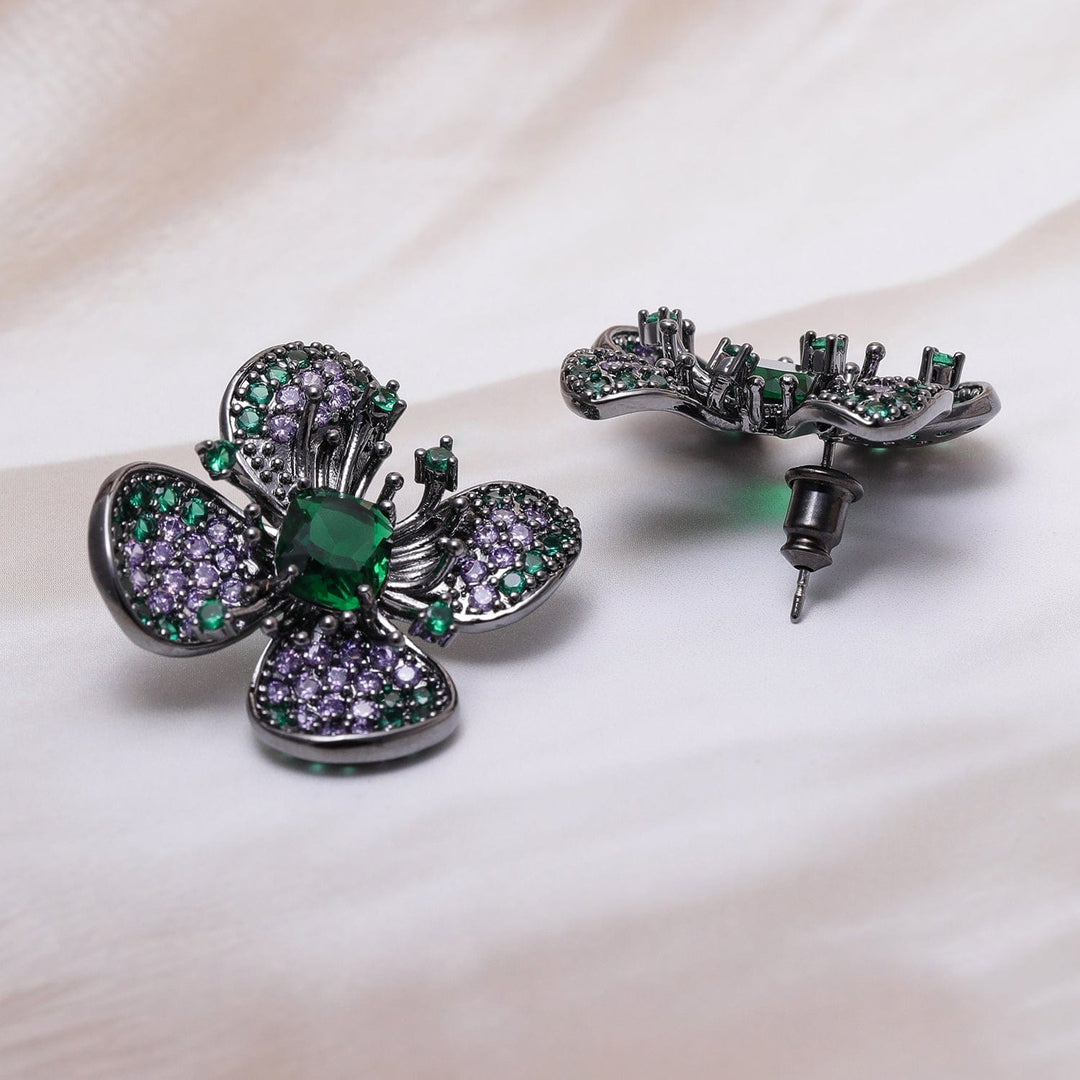 Voguish Rhodium-Plated Emerald & Lavender AD & Cubic Zirconia Studded Black-Tone Floral Stud Earrings Stud