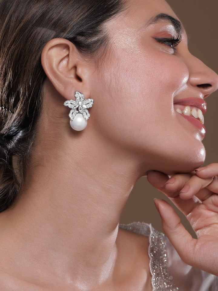 Voguish Rhodium Plated Sparkling AD & Cubic Zirconia Studded Floral Motif Pearl Drop Earrings Earrings