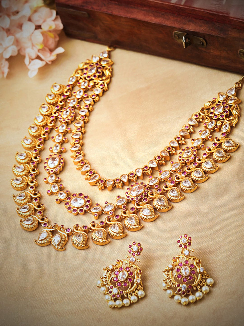 Rubans 22K Gold Plated Handcrafted  Faux Ruby & Paisley Shaped Layered Necklace Set Necklace Set