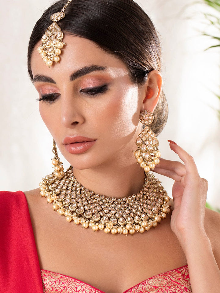 Rubans Gold Plated AD Studded Embellished With Pearls Statement Necklace Set With Maangtikka Necklace Set