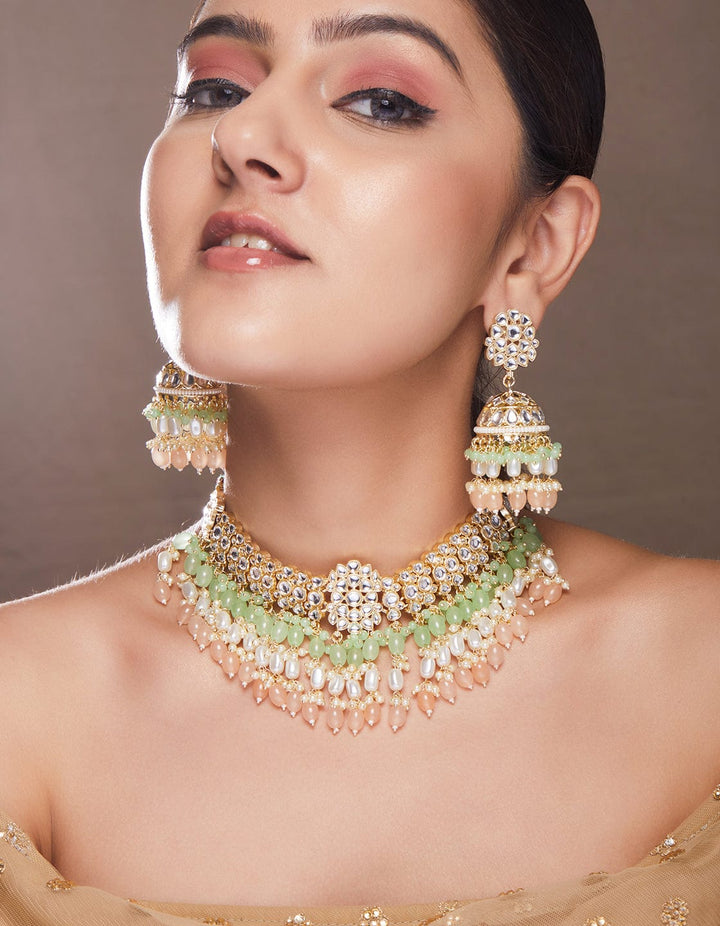 Rubans gold plated choker set with studded stones and mint green, beige colour beads. Necklace Set