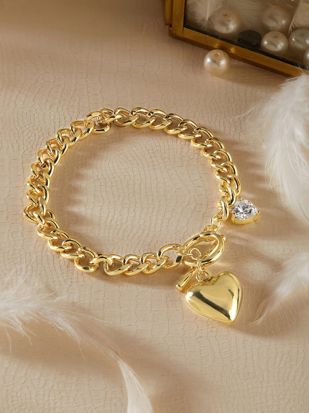 Rubans Voguish 18K Gold Plated Stainless Steel Waterproof Cuban Style Bracelet With Heart Charm And Zircon Studded Details. Bangles & Bracelets